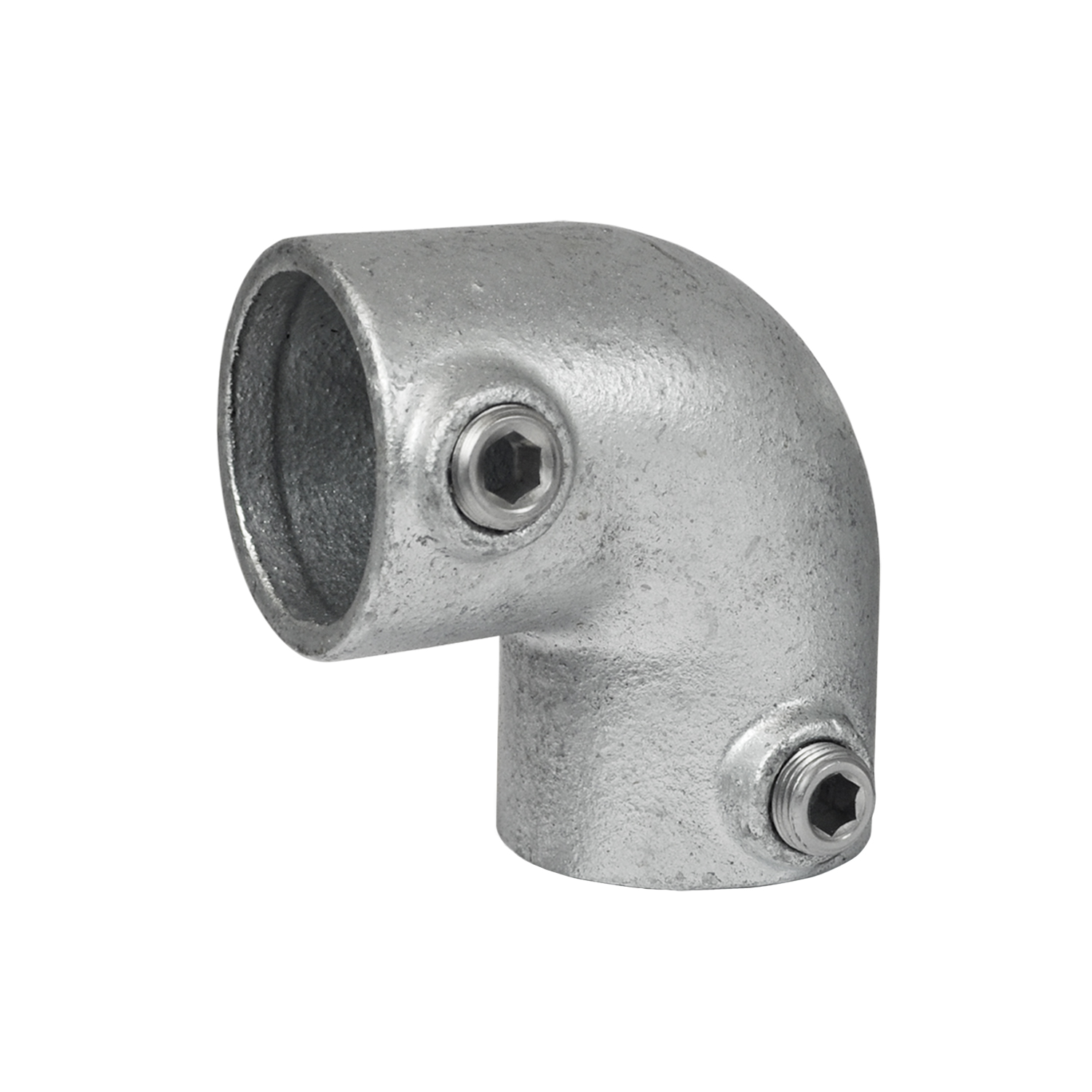 Conector robusto de 90 grados para tubos, fabricado en metal galvanizado, que actúa como codo. Desvía los tubos 90 grados. Superficie gris mate, ligeramente irregular. Dos tornillos hexagonales laterales fijan los tubos.