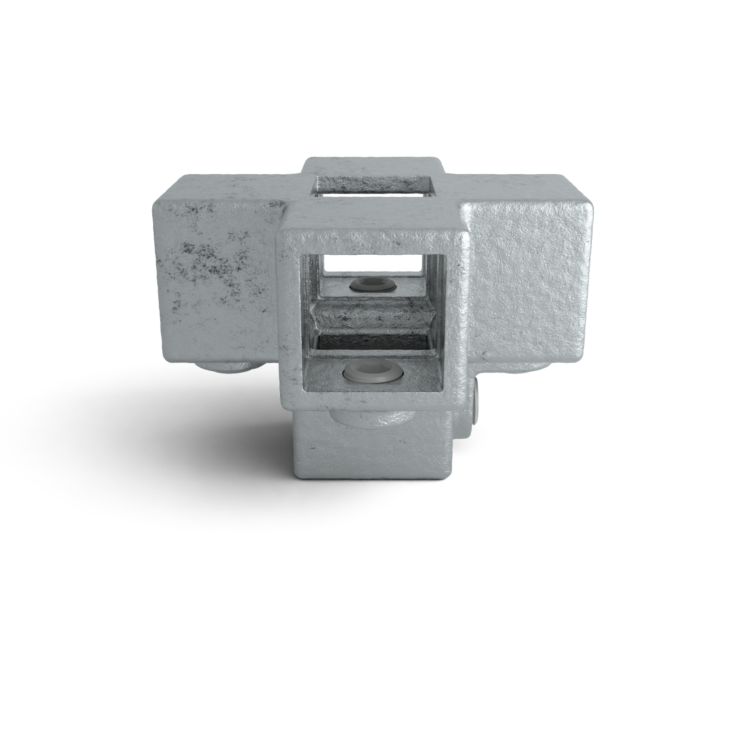 Conector industrial metálico gris, cúbico y rugoso, en forma de cruz. Aberturas rectangulares en los cuatro lados y en la parte superior e inferior para alojar perfiles. En los canales se ven tornillos o pasadores claros.